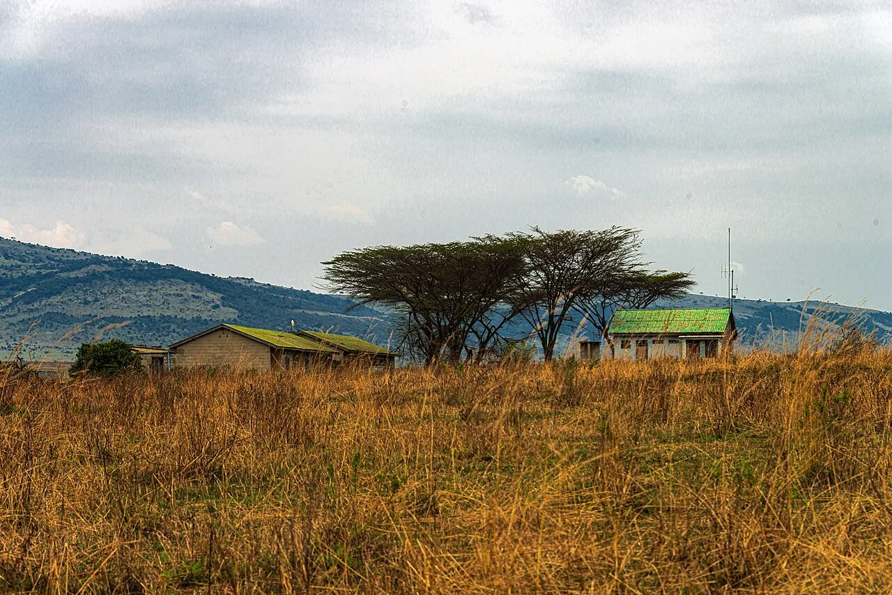 Per filename. Shot from just over the border. We were told those were once the customs stop on the Tanzanian side, in Serengeti National Park , now closed, but Google Maps suggests that it's part of a safari lodge used only seasonally. If that.