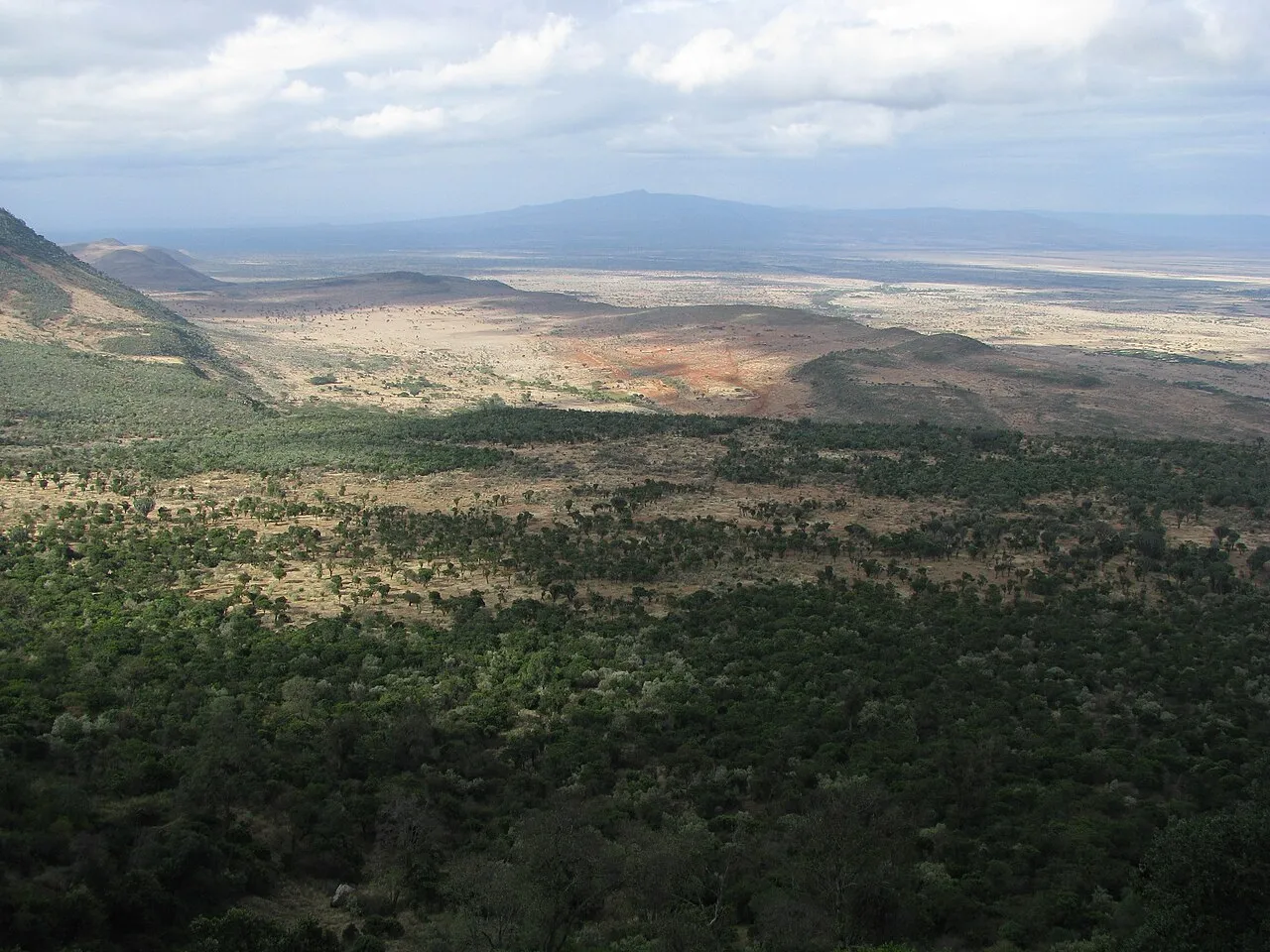 A view of the Great Rift Valley in Kenya. The Great Rift Valley is a name given in the late 19th century by British explorer John Walter Gregory to the continuous geographic trench, approximately 6,000 kilometres (3,700 mi) in length, that runs from northern Syria in Southwest Asia to central Mozambique in East Africa. (Oct/ Nov 2010)
